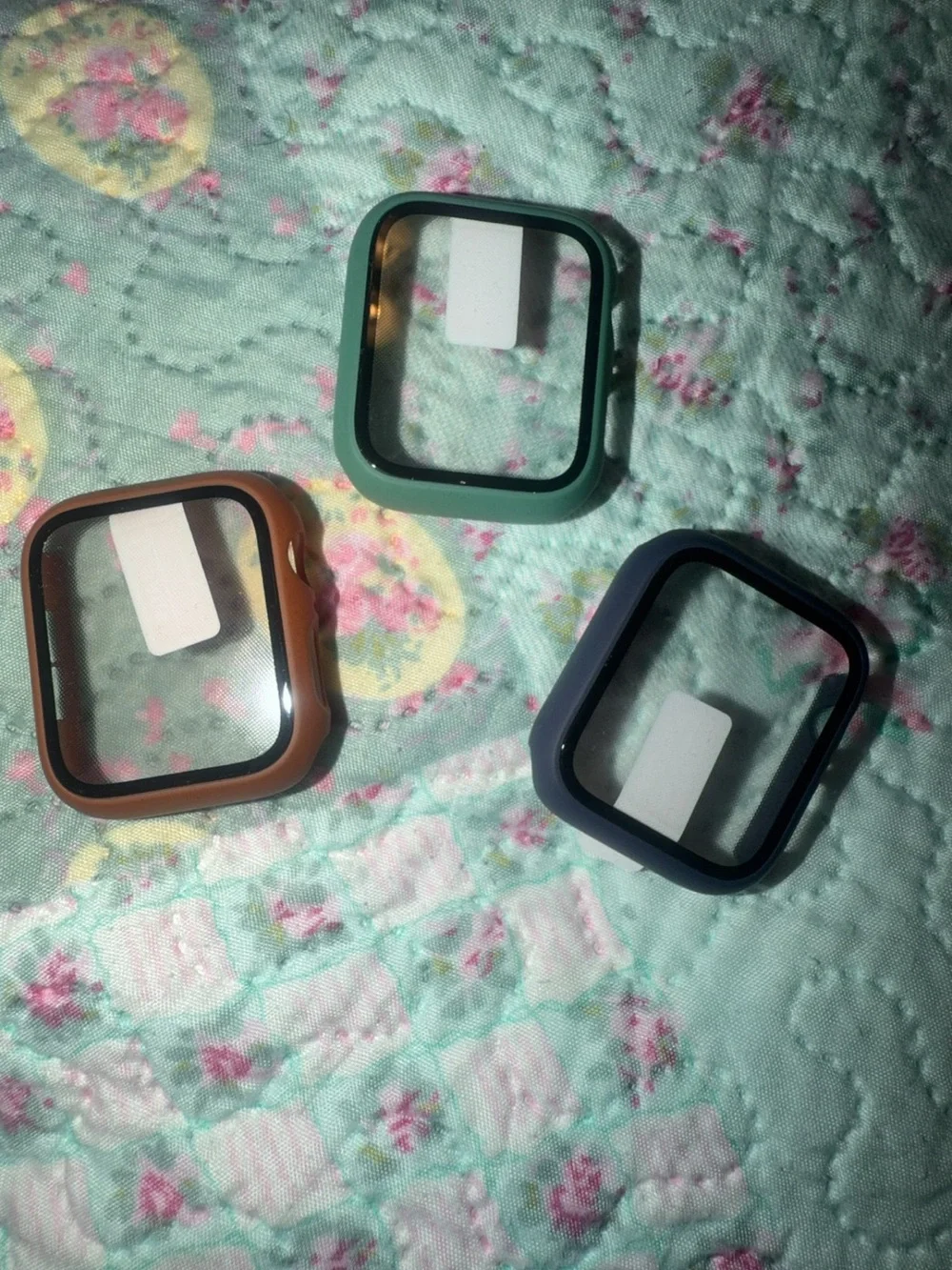 Silver Smartwatch with Multiple Colored Protective Cases and Charger